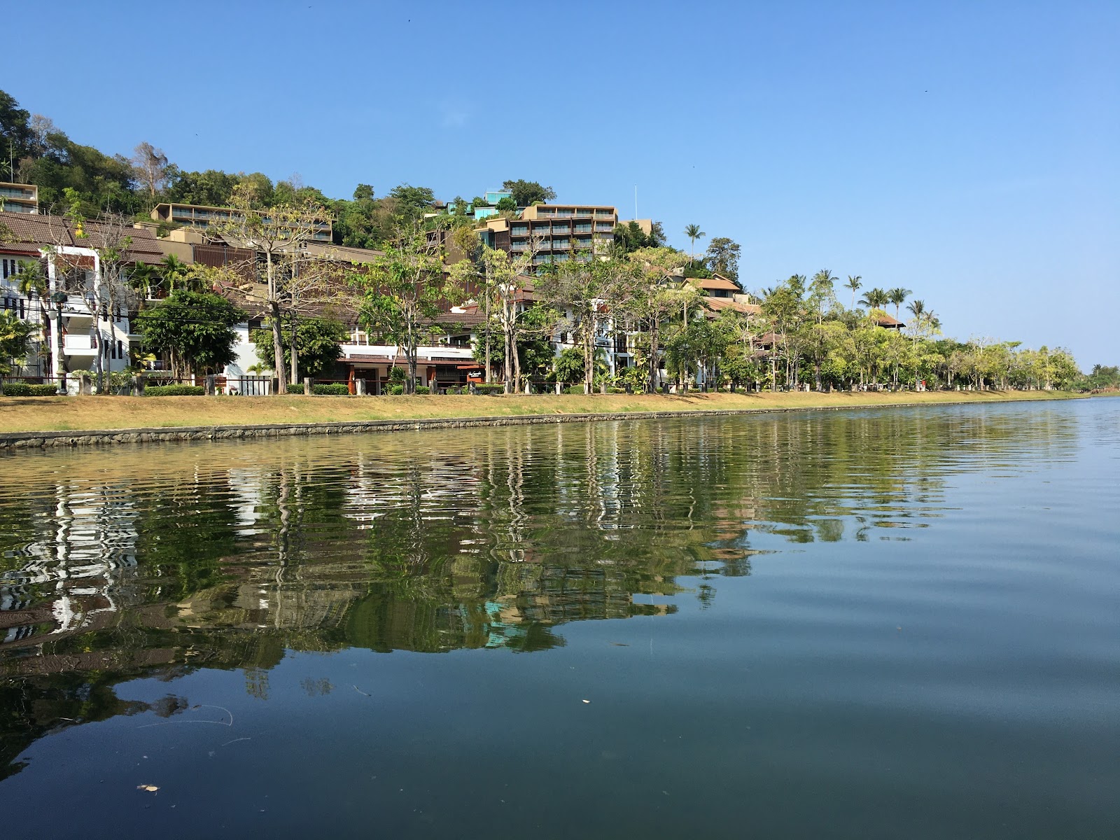 Nai Harn Beach Phuket beautiful bay with clear turquoise water and green hills